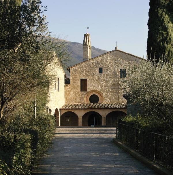 avenue leading to the church of San Damiano with portico and trees on either side